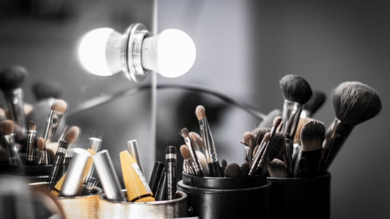 A makeup station with brushes and products ready for spa clients to freshen up after their visit