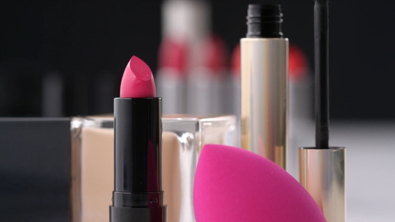 Pink lipstick with makeup tools showing personalized beauty products
